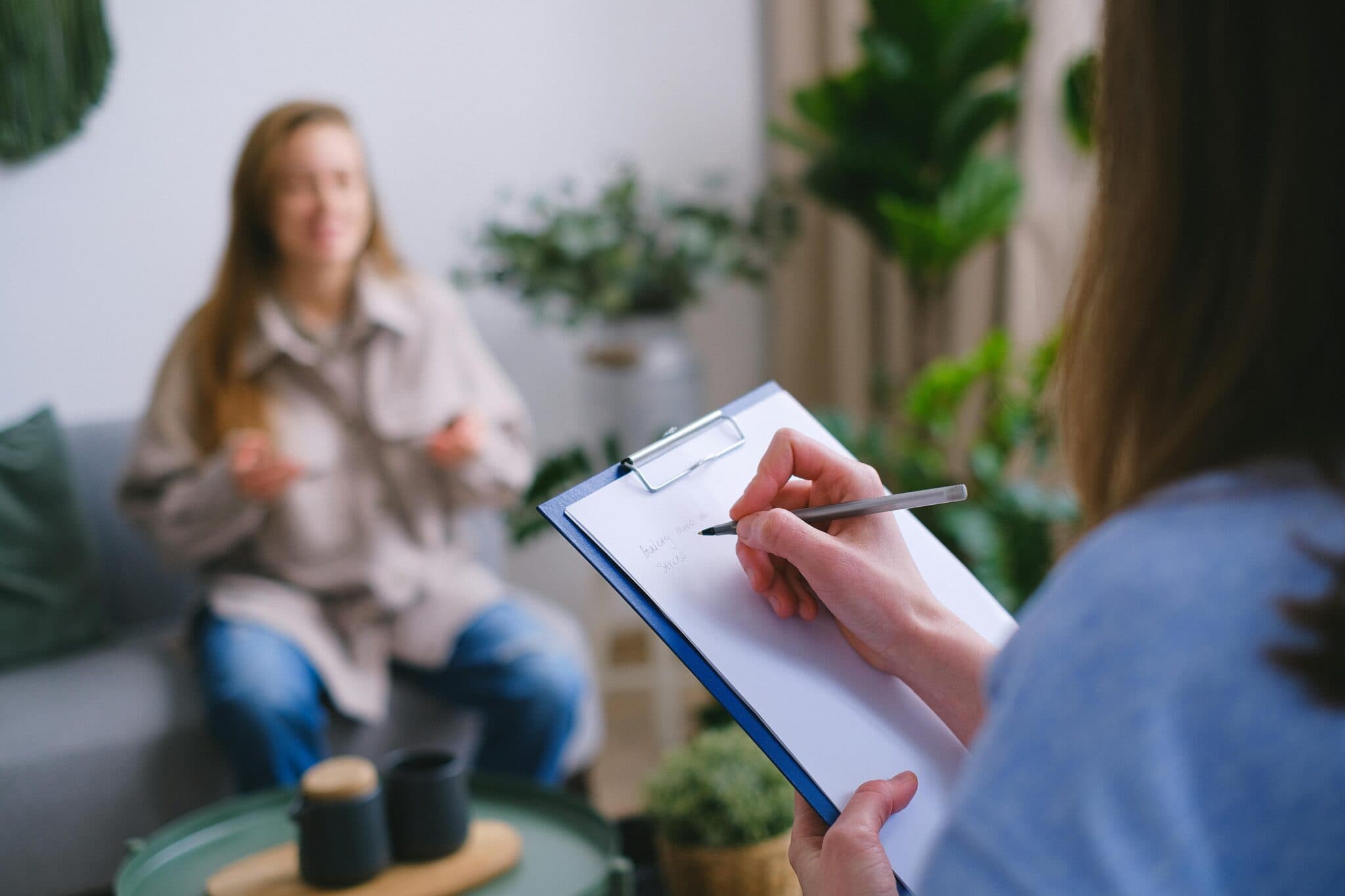 Therapist speaking with a client during a counselling session